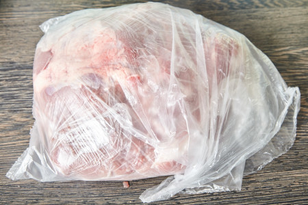 Put the meat in the bag for cuban roast pork shoulder
