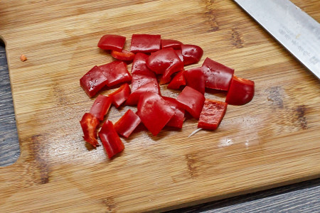Slice the peppers and then dice for chicken with vegetables in sour-sweet sauce