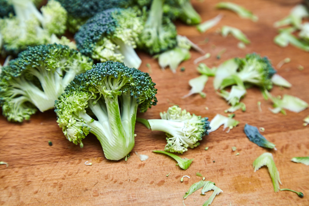 Peel the petioles using a vegetable peeler for asian broccoli with soy sauce and ginger