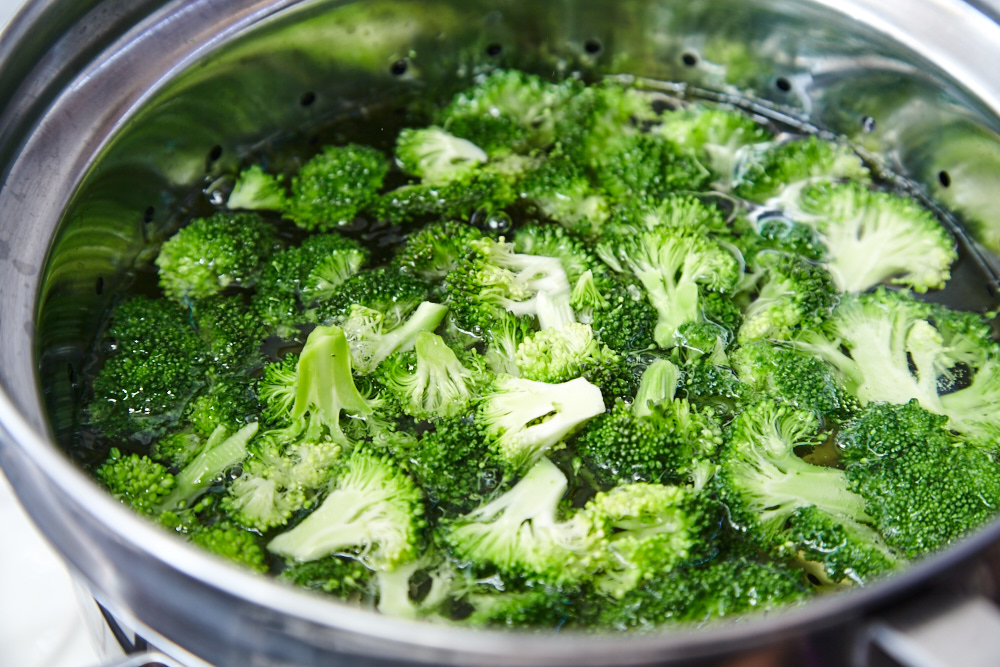 Cook the broccoli for asian broccoli with soy sauce and ginger