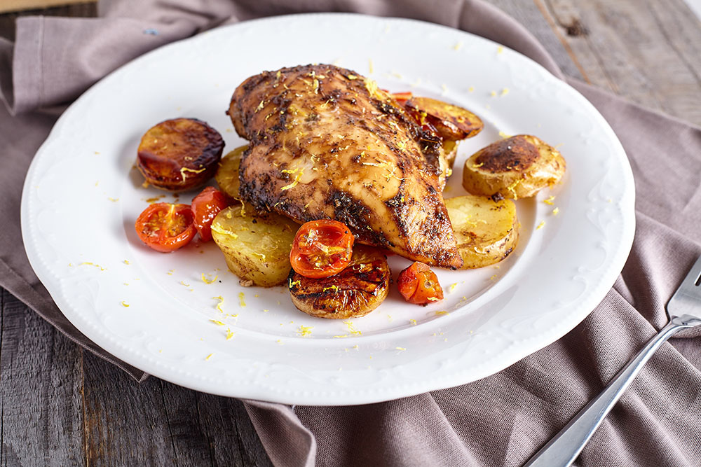 Grate some lemon zest for gentle chicken breasts baked with vegetables in balsamic-honey marinade