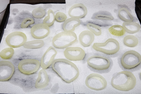 Put the rings on the baking sheet for beer battered onion rings
