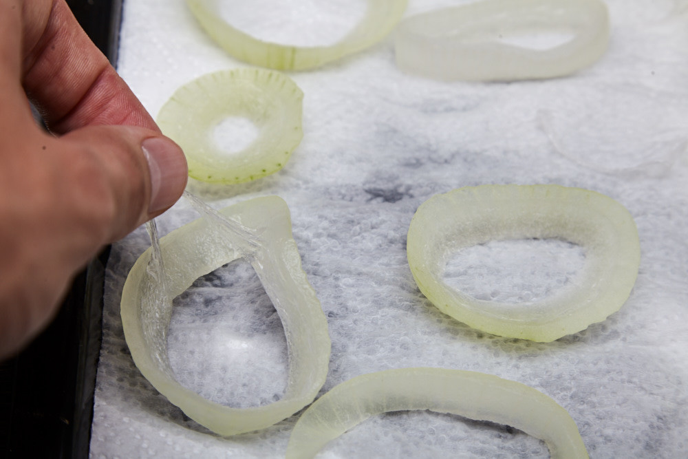 Remove the inner membrane from all rings for beer battered onion rings