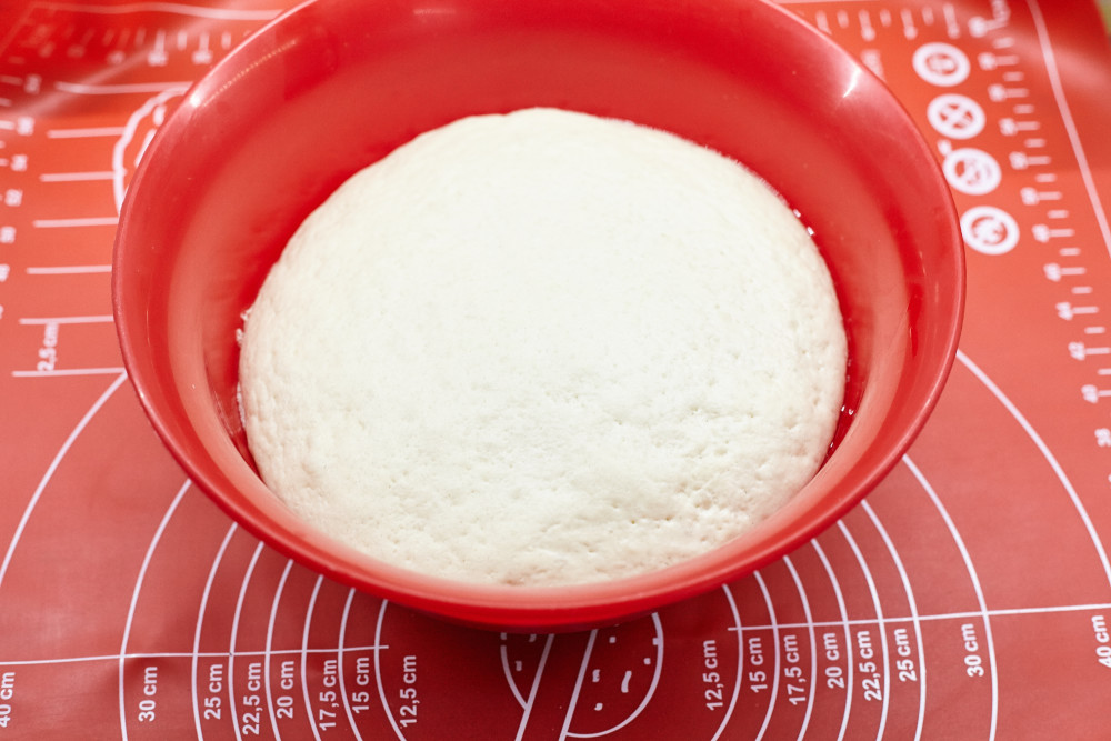 The dough after fermentation for italian breadsticks grissini