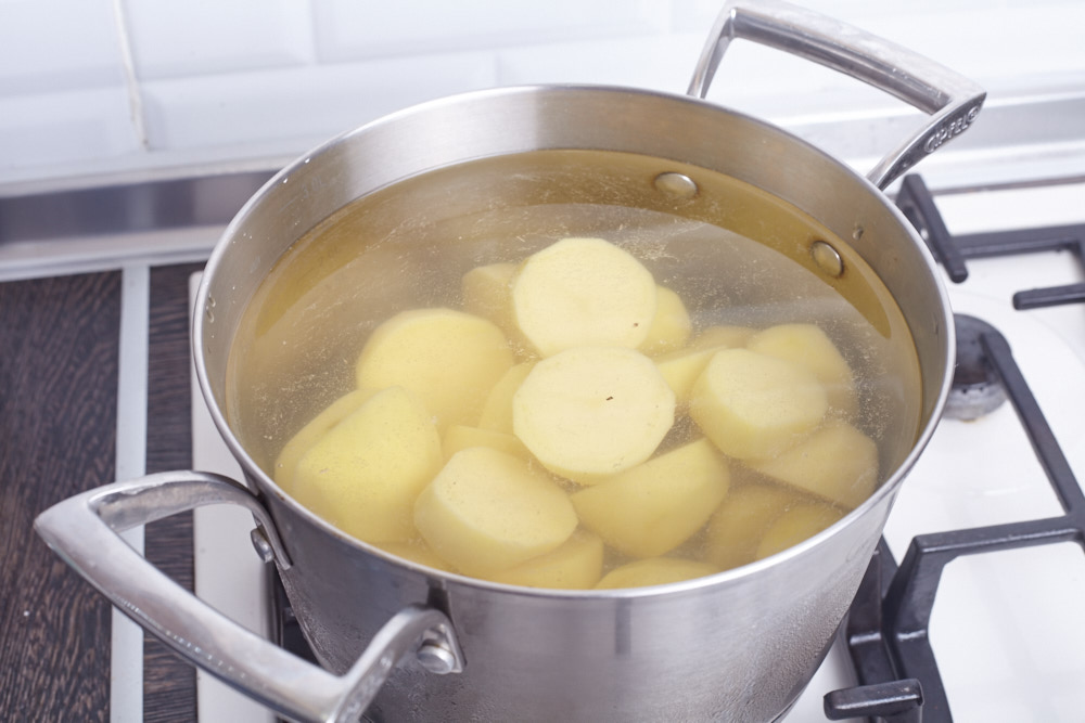 Boil the potato for perfect baked potato