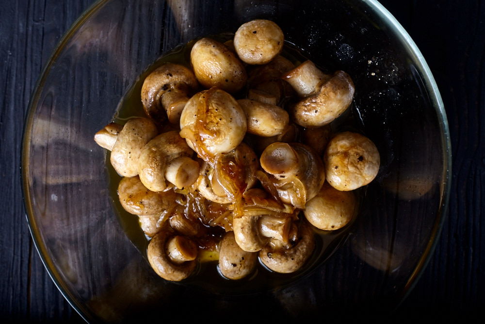 Transfer the mushrooms into a deep bowl for Gordon Ramsay’s pickled mushrooms