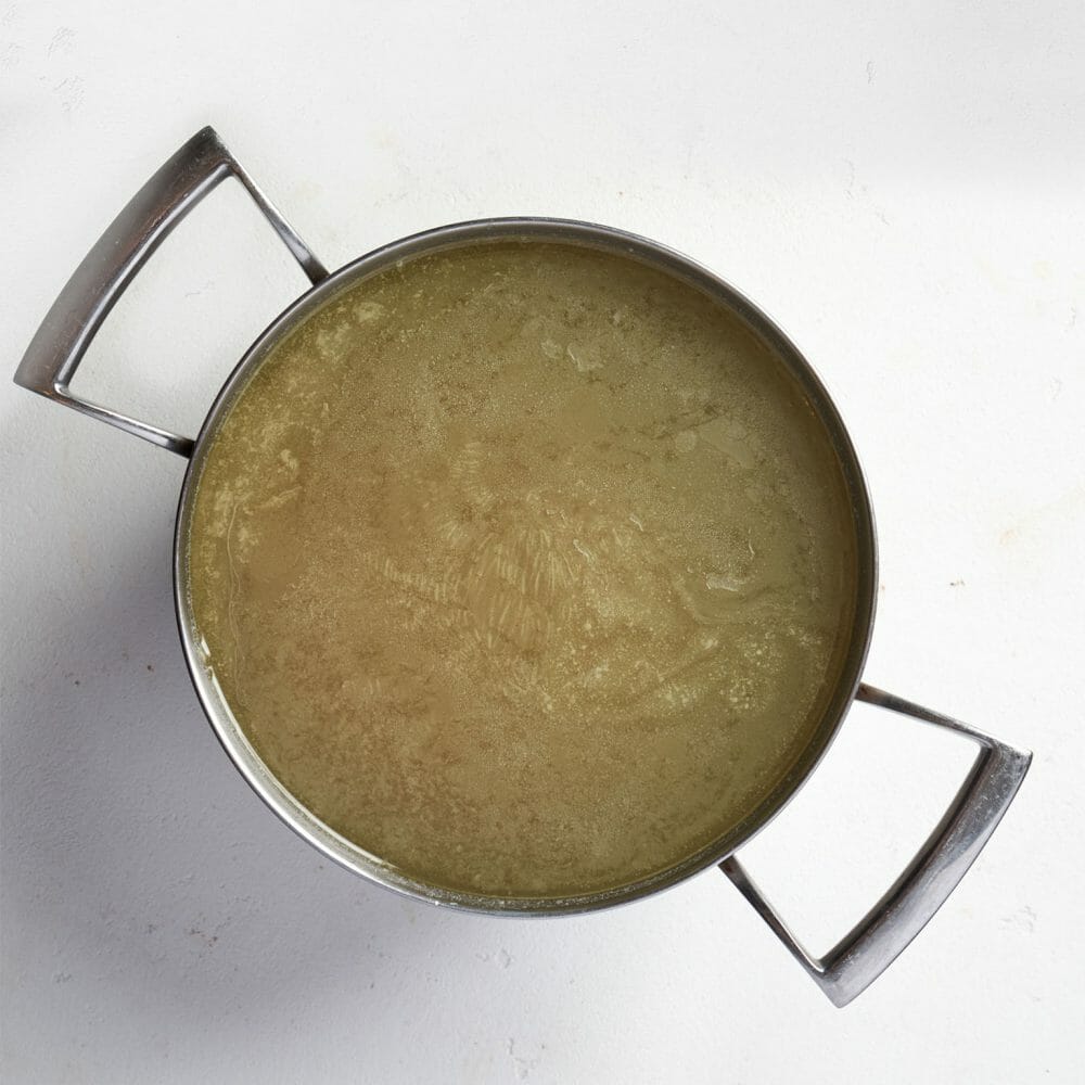 Step4-When the stock has completely chilled, use a spoon to remove the top layer of fat and limescale. Use it as intended at once or return it to the fridge or freeze it..-Basic Chicken Stock Recipe