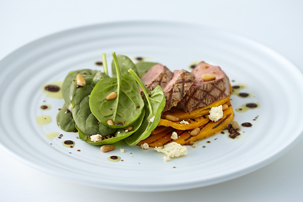 #7.  Salad with young lamb, pumpkin, spinach and pine nuts.