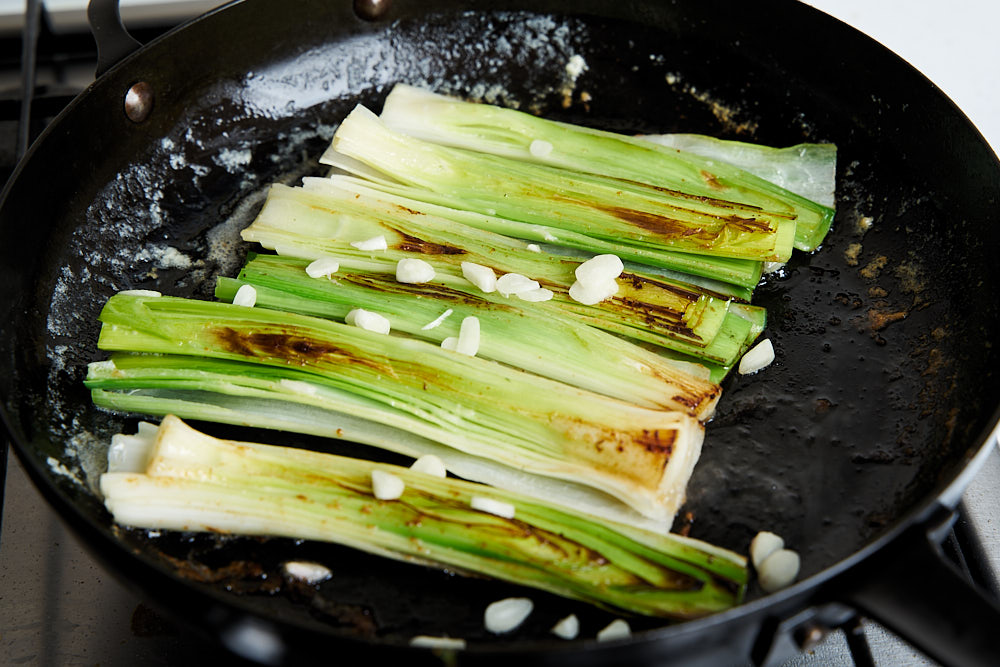Add the garlic to the leeks in the pan