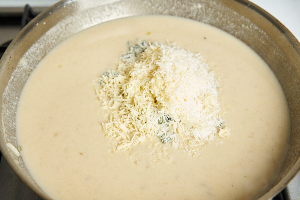 Add the cheese and stir with a whisk until the cheese is completely melted. 