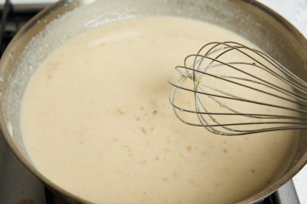 Add the cheese and stir with a whisk until the cheese is completely melted. 