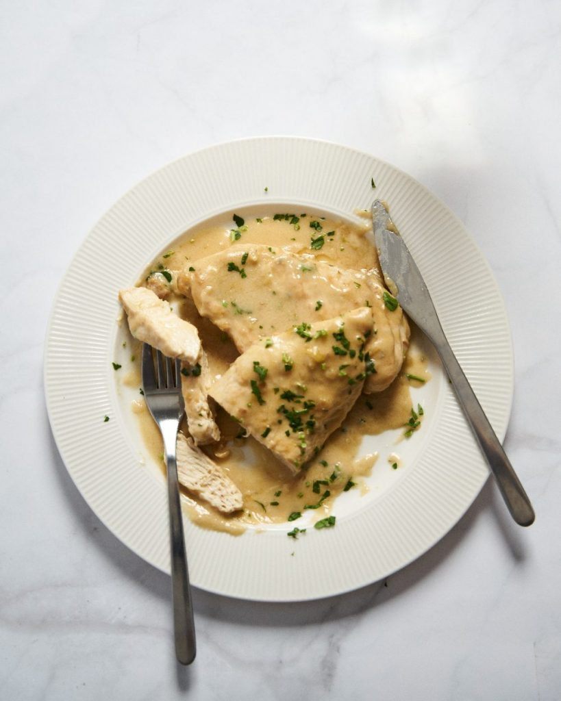 Chicken breasts in creamy wine and cheese sauce