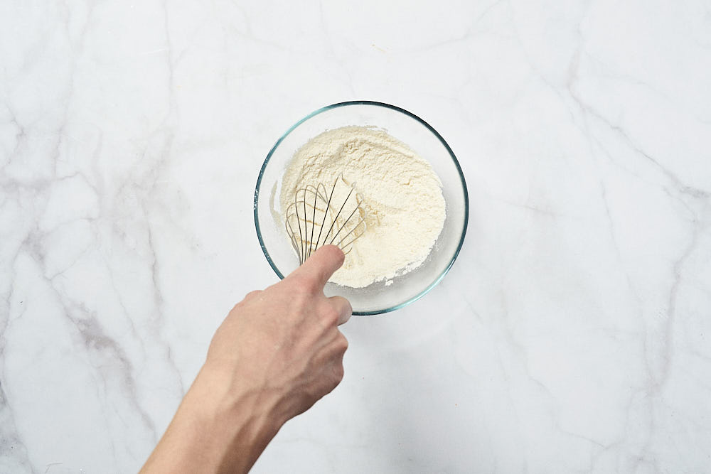 Sift flour for Gordon Ramsay's corn fritter dough 