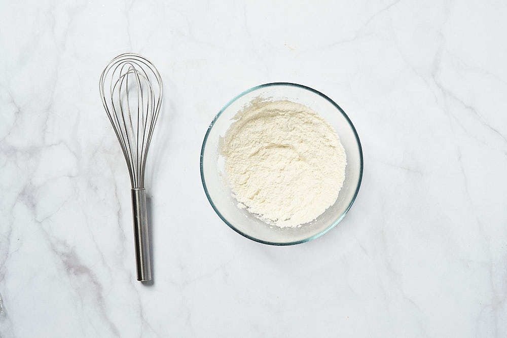 Sift flour for Gordon Ramsay's corn fritter dough 
