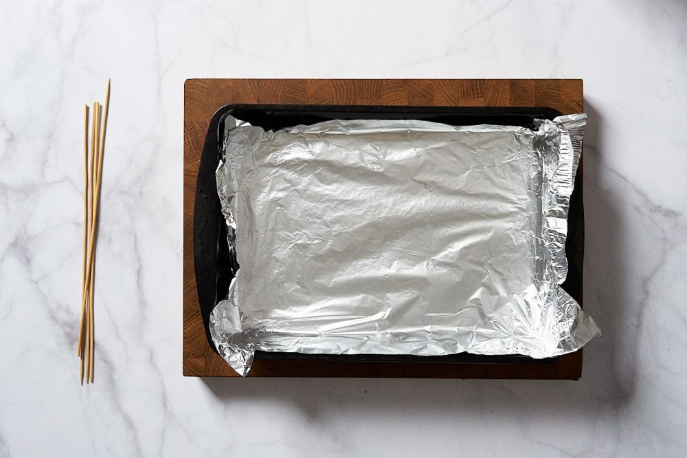 Cover the baking tray with foil