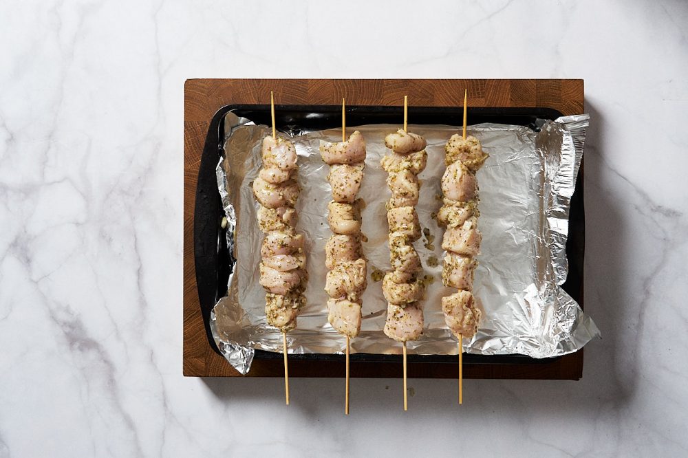 Put the chicken on the skewers
