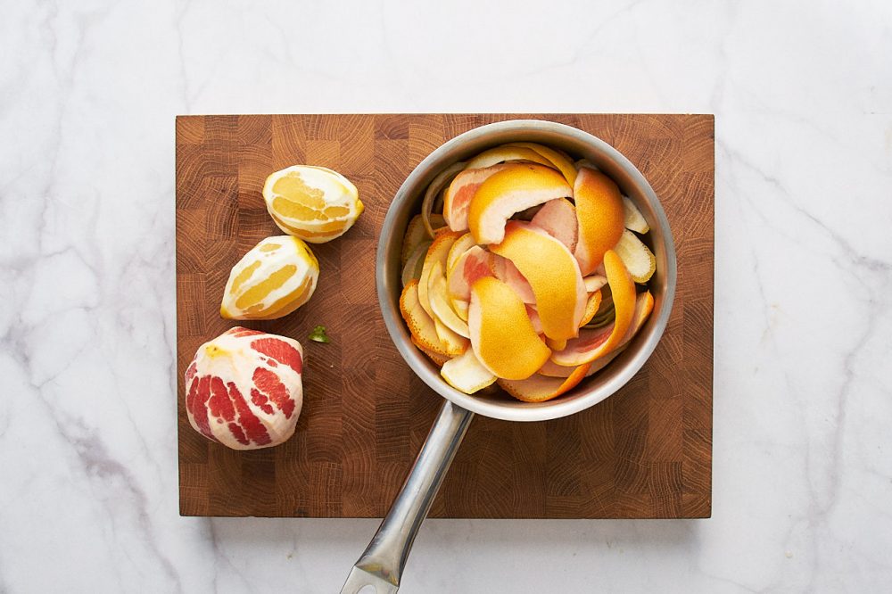 Put the citrus peels in a saucepan
