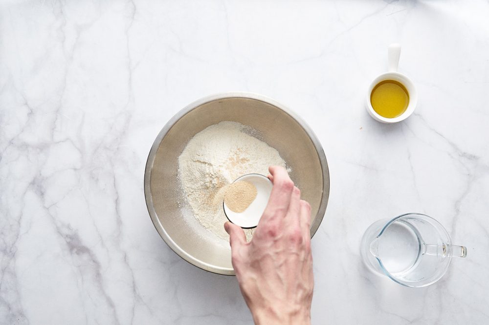 Mix flour, salt and yeast, mix with a whisk