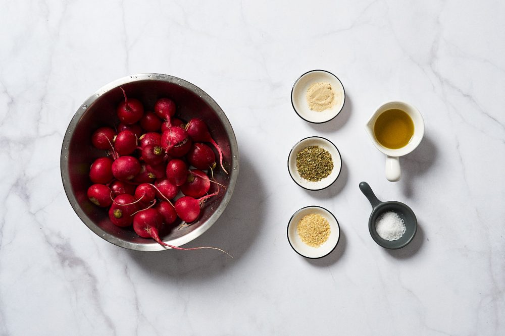 Ingredients for baked radishes: granulated garlic, oregano, olive oil, salt, dried onions
