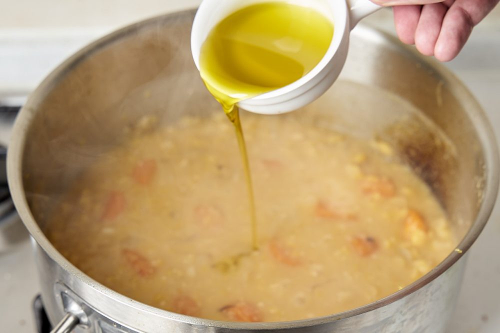 Pour in the olive oil