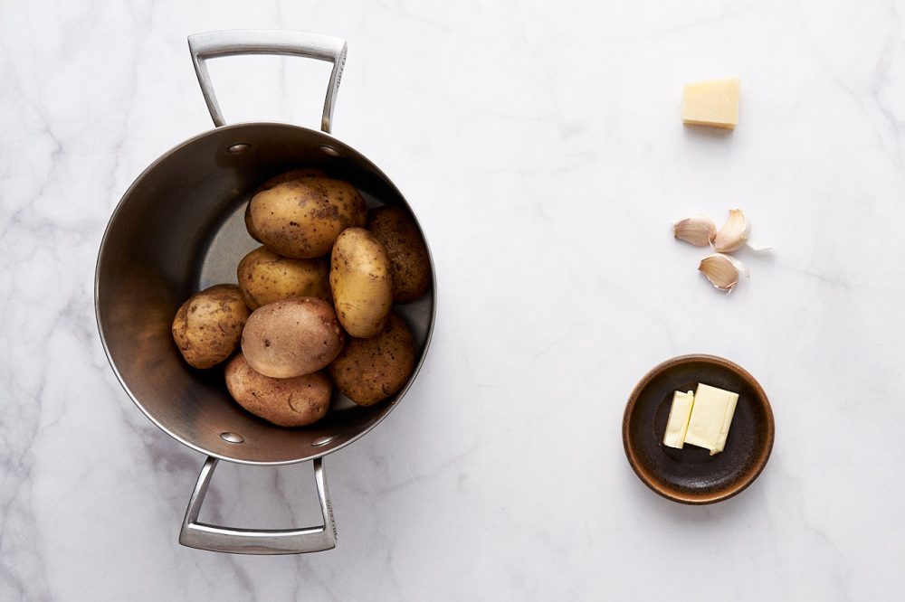 Ingredients for mashed potatoes: potatoes, butter, parmesan, garlic