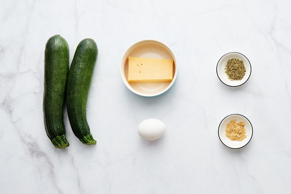 Ingredients for cooking zucchini with cheese in the oven: zucchini, cheese, egg, oregano, dried garlic.