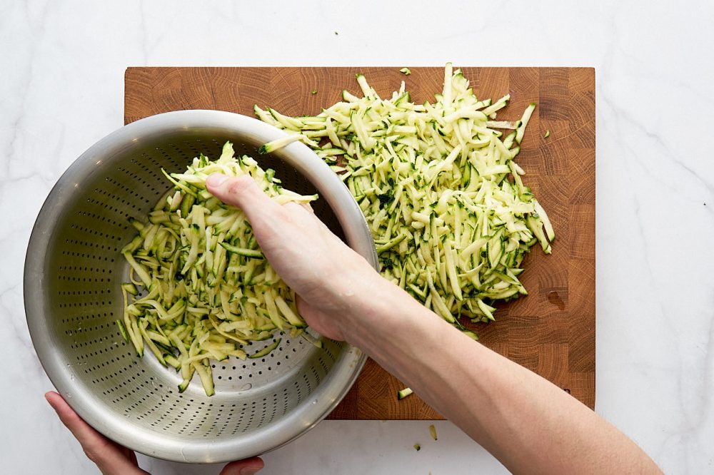Place grated zucchini in a colander
