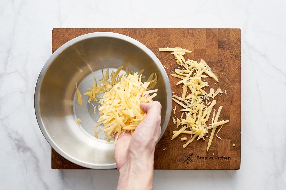 Transfer the grated cheese into a bowl