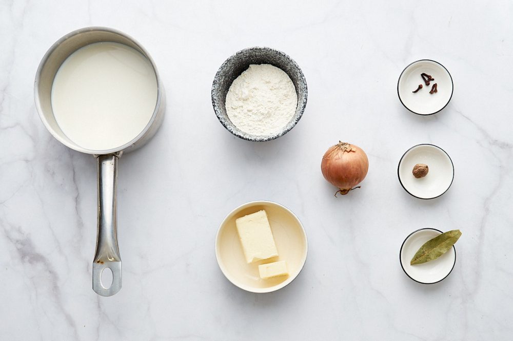Ingredients for Roux and Béchamel with Onion Cluté: flour, butter, milk, onion, clove buds, nutmeg, bay leaf.