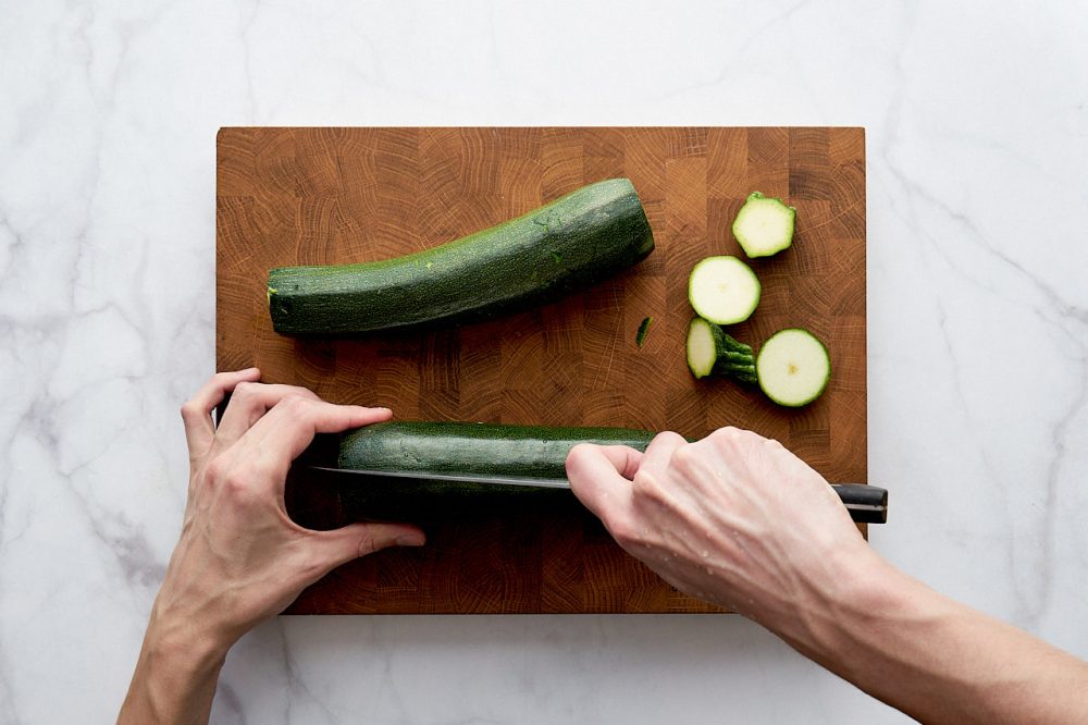 Cut the zucchini in half