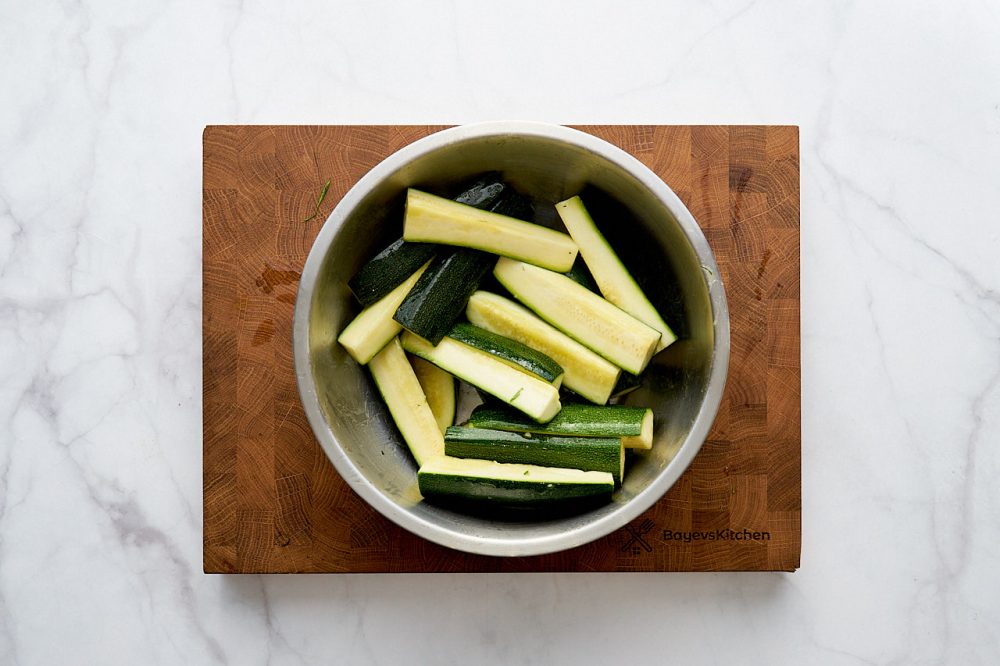 Stirred zucchini with olive oil in a bowl