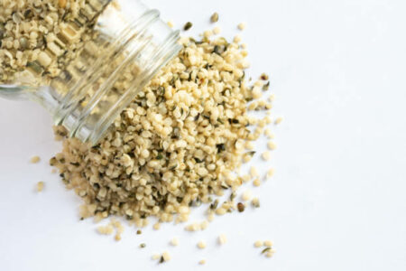 Quinoa seeds sprinkled out of a jar