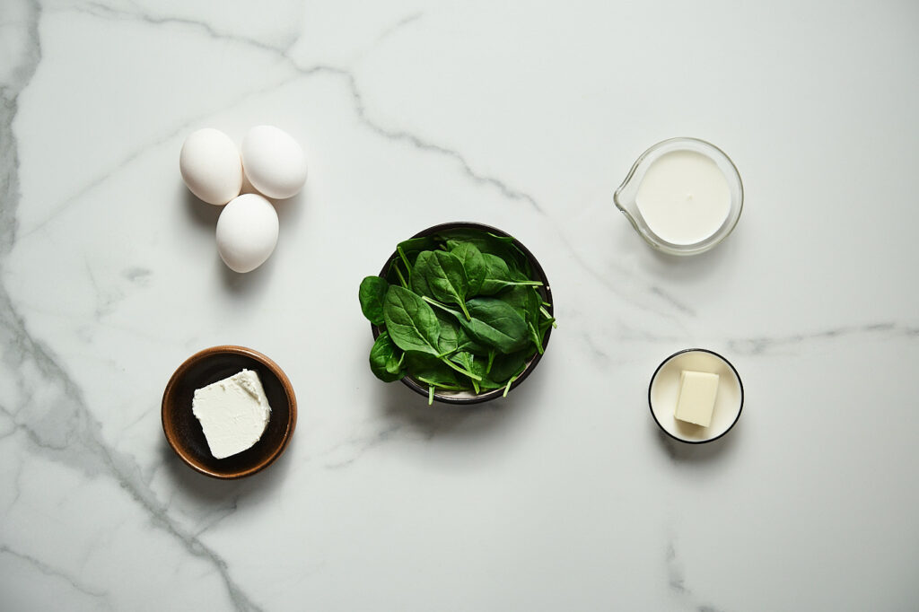 Ingredients for the spinach and feta omelet: eggs, spinach, feta, heavy cream, unsalted butter