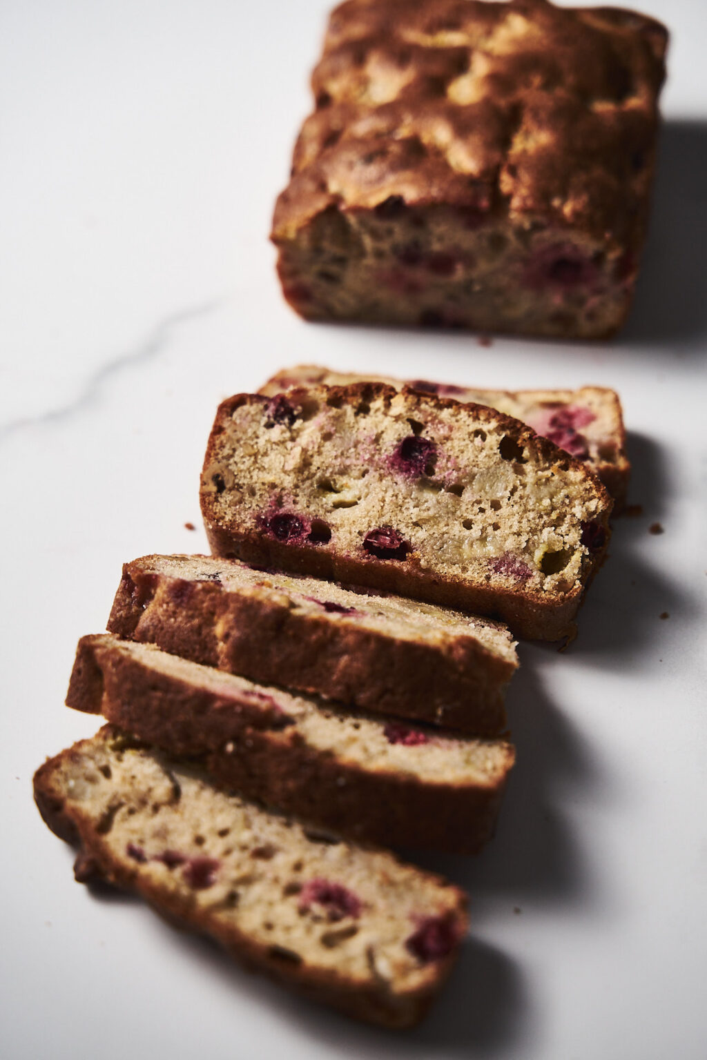 Sliced Banana Bread with cranberries and walnuts