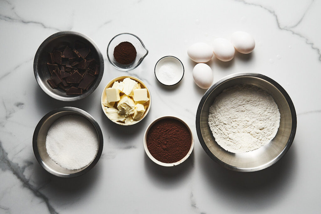 Ingredients needed to make an Espresso Brownie: butter, dark chocolate, sugar, freshly brewed coffee, eggs, cocoa, flour, salt