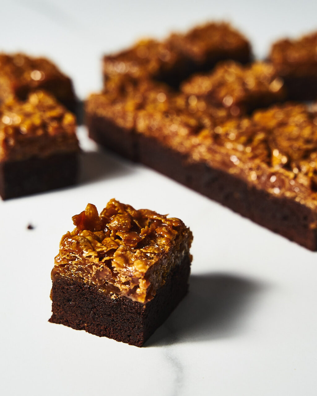 A slice of Brownie with crunchy cornflakes in salted caramel