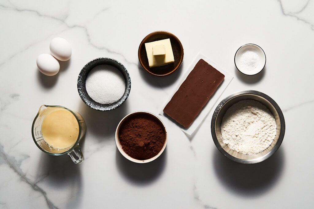 Ingredients needed to make condensed milk brownies: condensed milk, cocoa, flour, sugar, butter, eggs, chocolate, salt