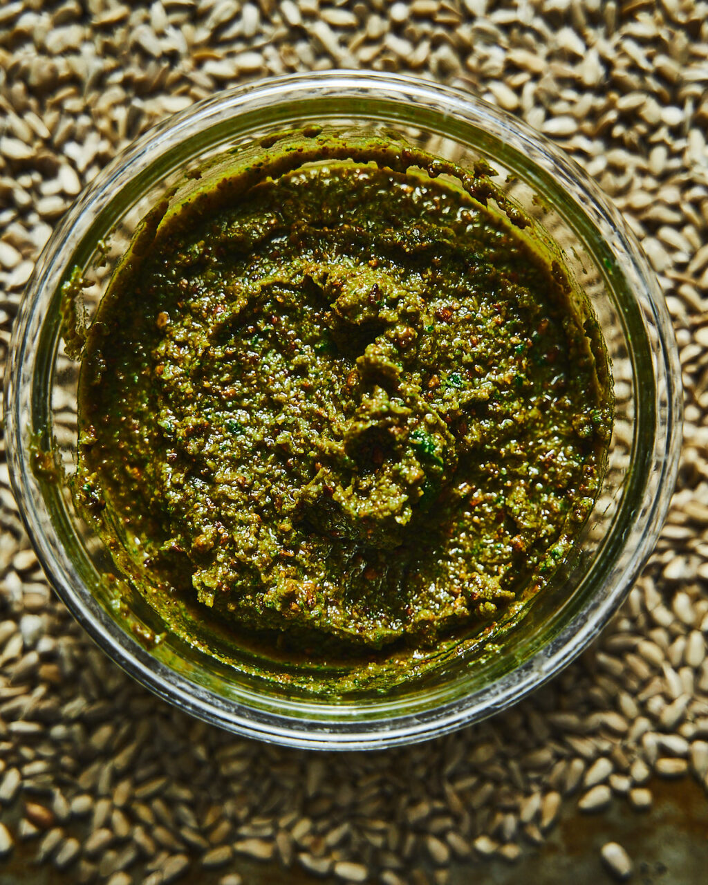 Pesto with sunflower seeds and spinach in a storage container